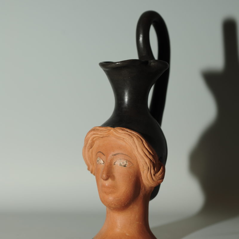 An Attic head-vase Oinochoe