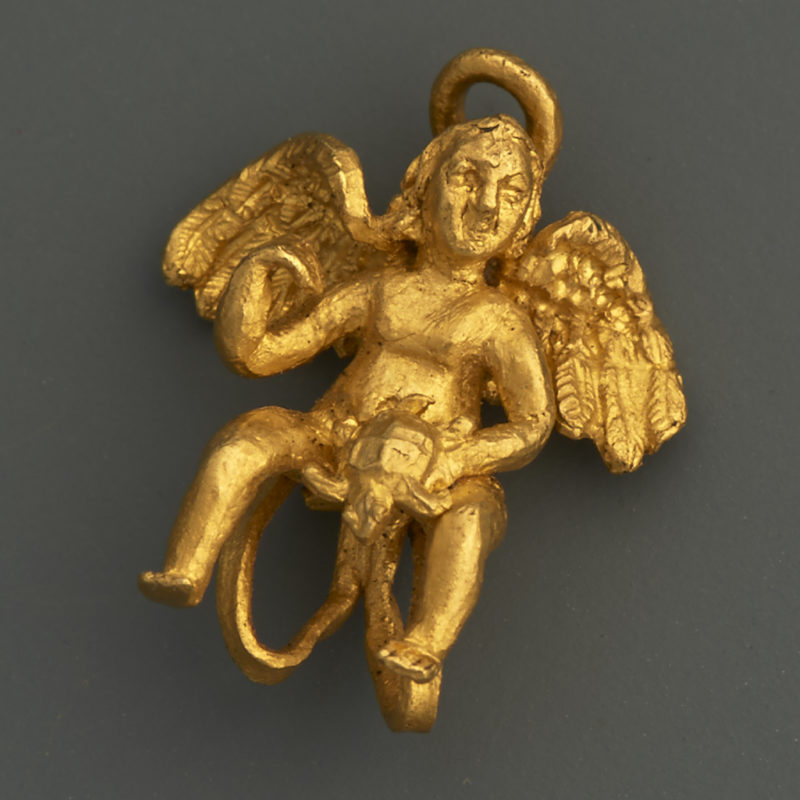 An Earring with Eros holding a Turtle